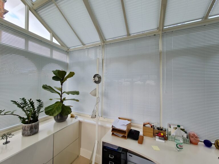 Pleated roof blinds and Venetian blinds in a conservatory, fitted by HomeDecisions
