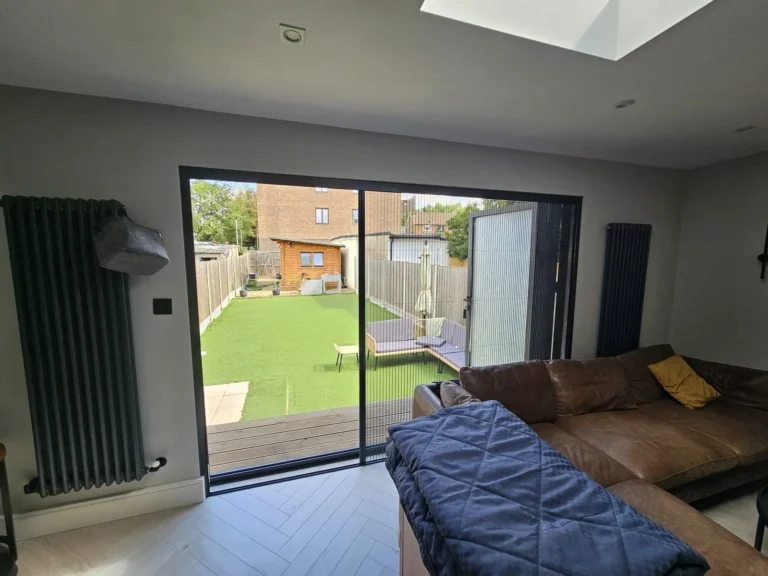 Pleated fly screen fitted to a door